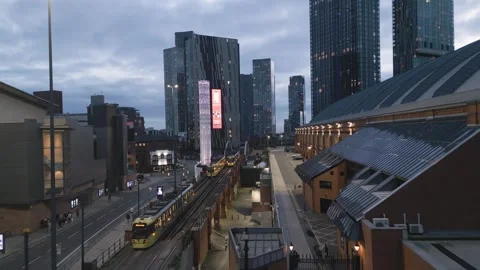Trams pass the Tower of Light, Manchester, England Vidéo 257556163