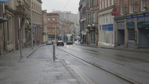 Trams passing through the busy streets of Nottingham Stock Footage 112972387
