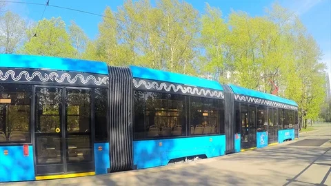 Trams at a tram stop on a spring day timelapse Stock Footage 82980380