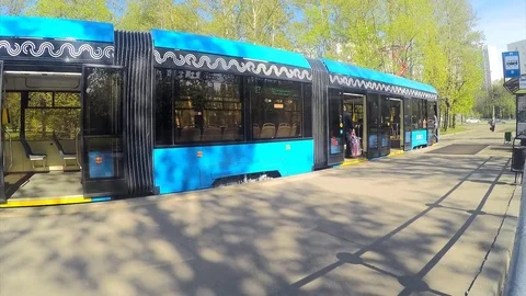 Trams at a tram stop on spring day timelapse 動画素材 82983940