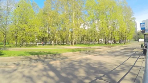 Trams at tram stop in the spring timelapse Stock Footage 82980981