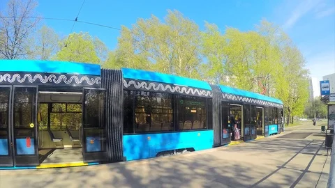 Trams at tram stop in spring timelapse Stock Footage 82986302