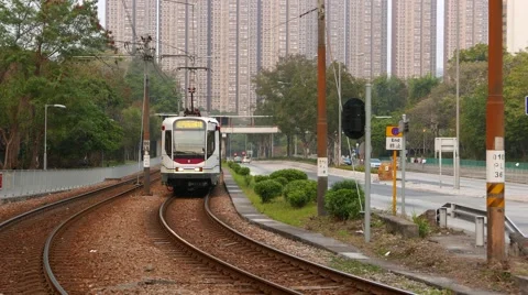 Tramway approaching and turn left on rails, urban background Stock Footage 50013718