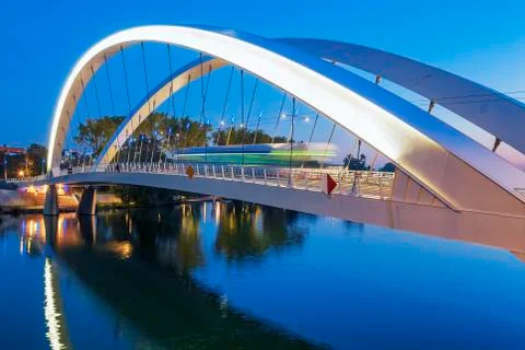 Tramway on the bridge at night Stock Photos