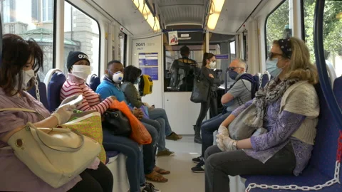 Tramway commuters with protective mask during Covid-19 emergency. Vídeo Stock 130945767