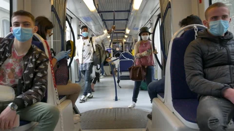 Tramway commuters with protective mask during Covid-19 emergency. 库存影片 130954601