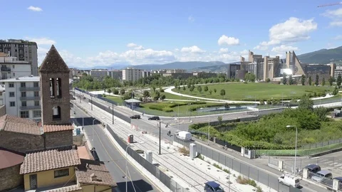 Tramway construction site with old style church, park and modern buildings Stock Footage 75913798