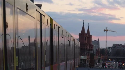 Tramway leaves station in the evening at sunset in Berlin Kreuzberg Stock Footage 196944233