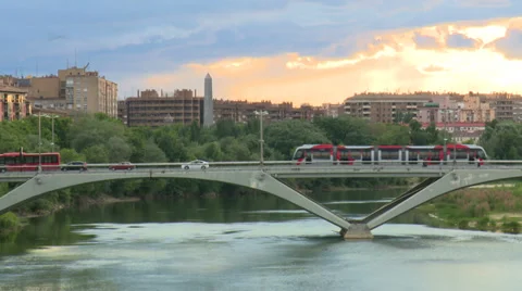 Tramway over the river bridge with background sunset sky Stock Footage 38715578