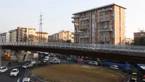 The tramway passes on the bridge through the Novoli district in Florence. Italy. Stock Footage 103994668