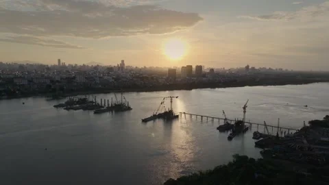 Tran Hung Dao Bridge Construction over Red River at Sunset Stock Footage 337786713