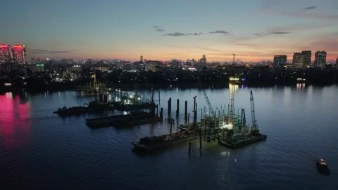 Tran Hung Dao Bridge construction on Red River, Hanoi at dusk Stock Footage 337787348