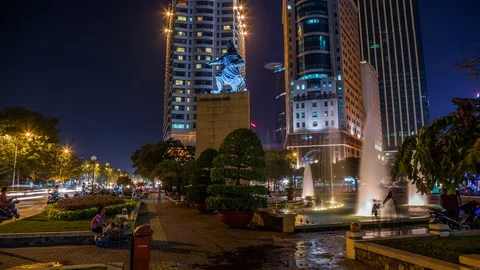 Tran Hung Dao statue in front of hotel and office tower, Ho Chi Minh City Stock Footage 116859399