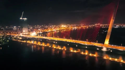 Tran thi ly bridge arching gracefully over han river, red suspension cables Stock Footage 311450761
