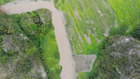 Trang An Mountain with river &amp; rice fields Stock Footage 89861075