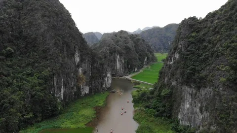 Trang An Mountain with river &amp; rice fields Stock Footage 89861271
