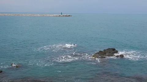 Trani - Waves on the rock of the pier Stock Footage 108336445