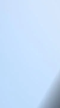 A tranquil abstract gradient blends pale blue and near-white tones with a s.. Иллюстрация