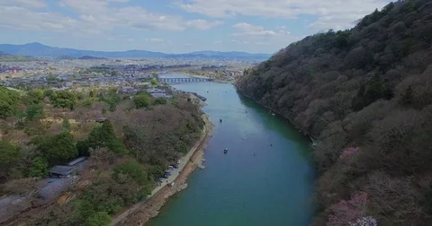 Tranquil aerial footage down a river in Kyoto Stock Footage