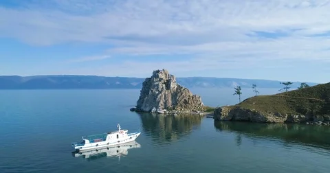 Tranquil Aerial View of the Baikal Bay Shamanka. White ship in calm bay Stock Footage 80679398