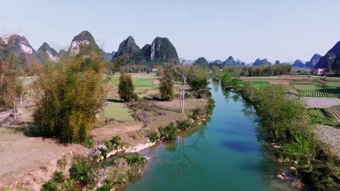 Tranquil Aerial View of Valley with River and Rice Fields in Cao Bang Stock Footage 277560546