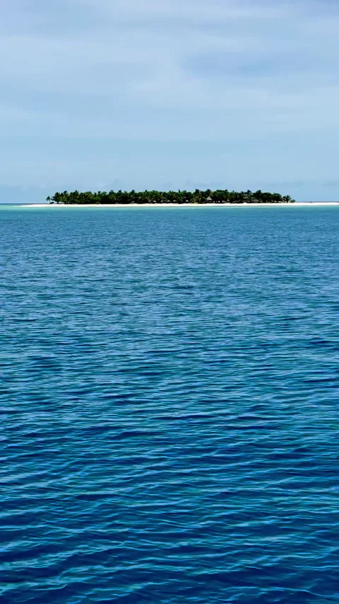 The tranquil and clear blue waters of the ocean in Fiji Stock Footage 312976115