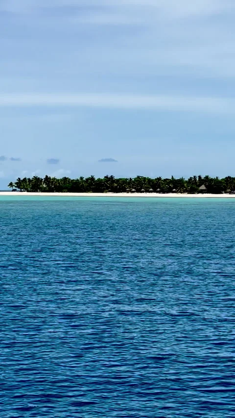 The tranquil and clear blue waters of the ocean in Fiji Stock Footage 312976224