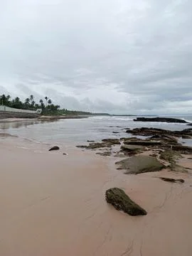 Tranquil and cloudy beach scene Stock Photos