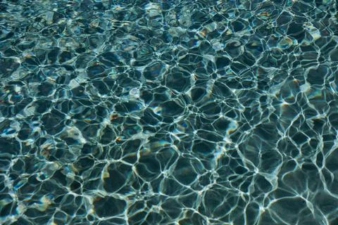 Tranquil azure waters a captivating abstract view of rippling pool surface Stock Photos