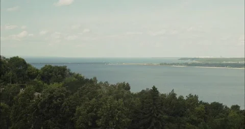 Tranquil bay view with lush green forest Stock Footage 304780346