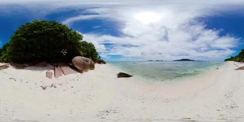 Tranquil beach with clear waters and boulders. La Digue, Seychelles. Stock Footage 301503253