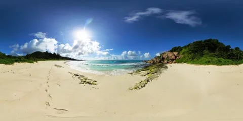 Tranquil beach with footprints in the sand. La Digue, Seychelles. Stock Footage 302772899