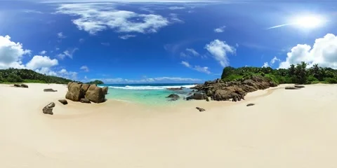 Tranquil beach oasis under a bright sun in Seychelles. Stock Footage 311037439