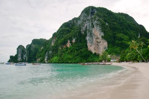 Tranquil beach on Phi Phi Don island, Thailand, on a hot cloudy day Stock Photos