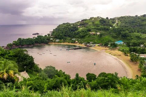 Tranquil beach scene with an array of colorful boats floating in the lake Fotos de archivo