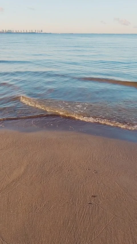 Tranquil Beach Scene with Gently Rolling Waves Stock Footage 310660019