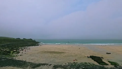Tranquil Beach Scene Under Overcast Sky at St.Ives beach, Cornwall Stock Footage 288145670