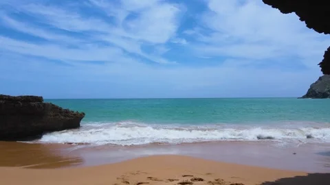 Tranquil Beach Scene with Waves and Blue Sky Video stock 330380442