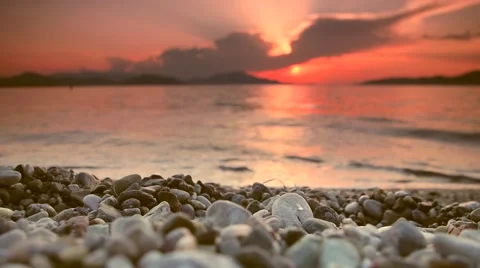 Tranquil beach sunset scene. Close focus, distant subjects out of focus. Video stock 51721181