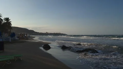 Tranquil Beach Sunset with Waves and Chairs 8K 30fps Video stock 317766971