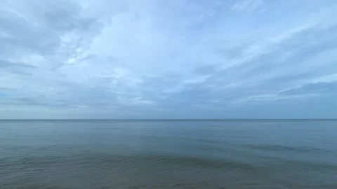Tranquil beach surface sunlight Видео 341176512