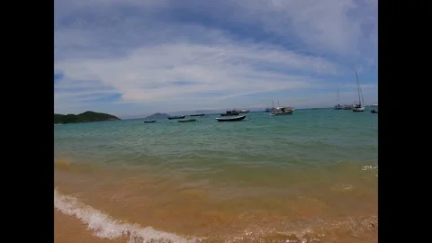 Tranquil Beach Vibes with Transparent Ocean Waves Stock Footage 300595841