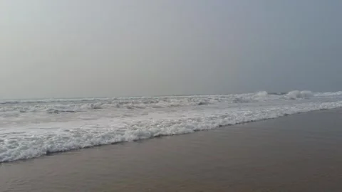 Tranquil Beach Waves in Natural Light 스톡 동영상 331114179