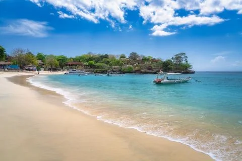 A tranquil beachscape featuring stunning turquoise waters alongside gentle .. Stock Photos