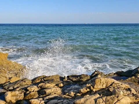 Tranquil beachside landscape features, calm shoreline scene with shimmering.. Photos