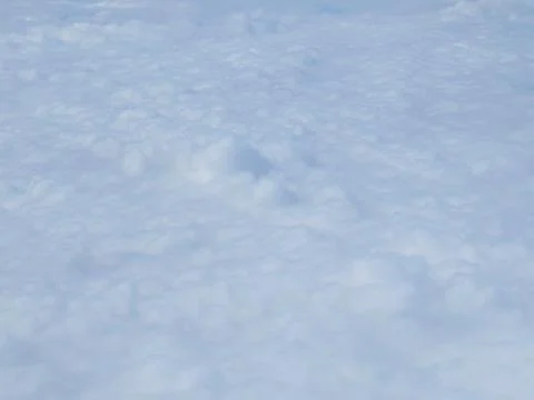 Tranquil Beautiful View From Plane Window at Blue Sky over White Clouds Stock Photos
