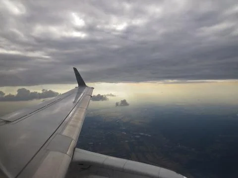 Tranquil Beautiful View From Plane Window at Blue Sky over White Clouds with  Stock Photos