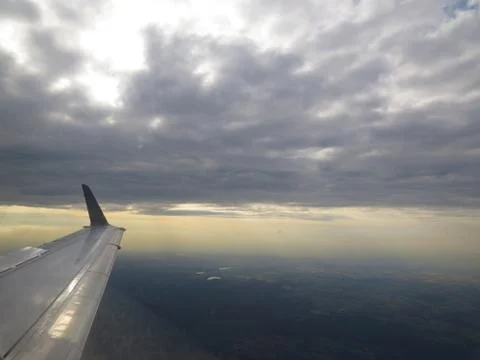 Tranquil Beautiful View From Plane Window at Blue Sky over White Clouds with  Stock Photos