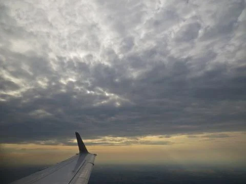 Tranquil Beautiful View From Plane Window at Blue Sky over White Clouds with  Stock Photos
