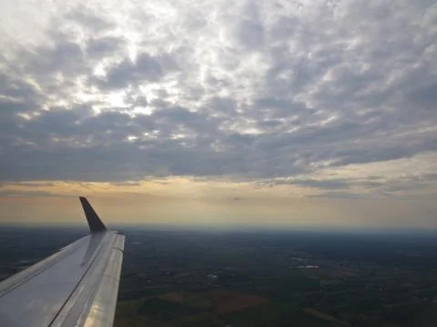 Tranquil Beautiful View From Plane Window at Blue Sky over White Clouds with  Stock Photos